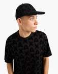 Armani Exchange All Over Logo Cotton Cap With Snap Fastener | LEVISONS