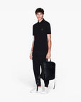 Armani Exchange Black And Gold Regular Fit Cotton Polo Shirt With Logo Patch | LEVISONS