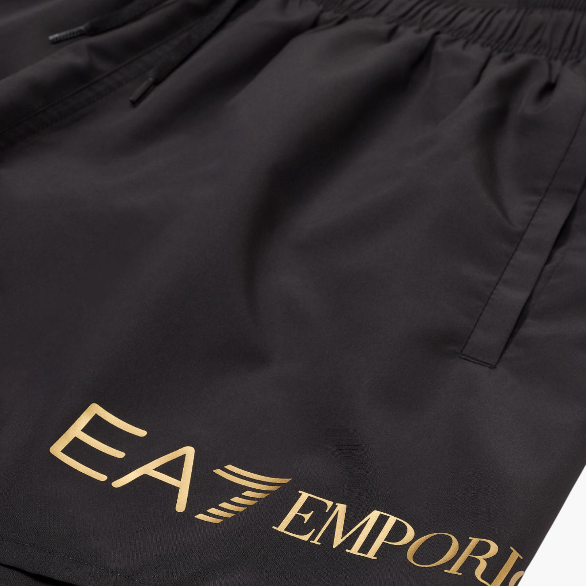 EA7 Swim Shorts With Gold Logo | LEVISONS